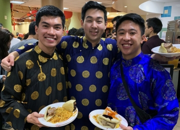 students sample the cuisine before performing at Lunar New Year